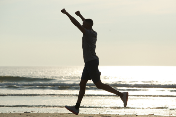 Man running on beach